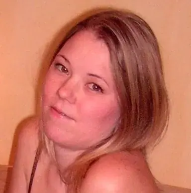 Close-up portrait of a woman with blonde hair looking at the camera, used for Barbara massage in Budapest