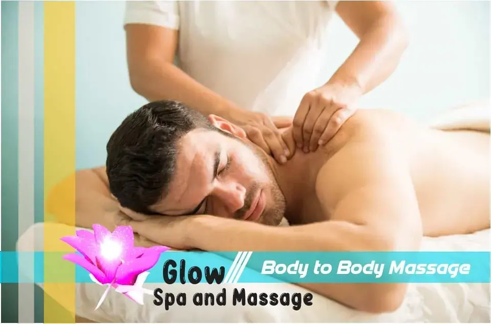 A shirtless man lies face down on a massage table while a therapist works on his neck and shoulder at Glow Spa, Mumbai