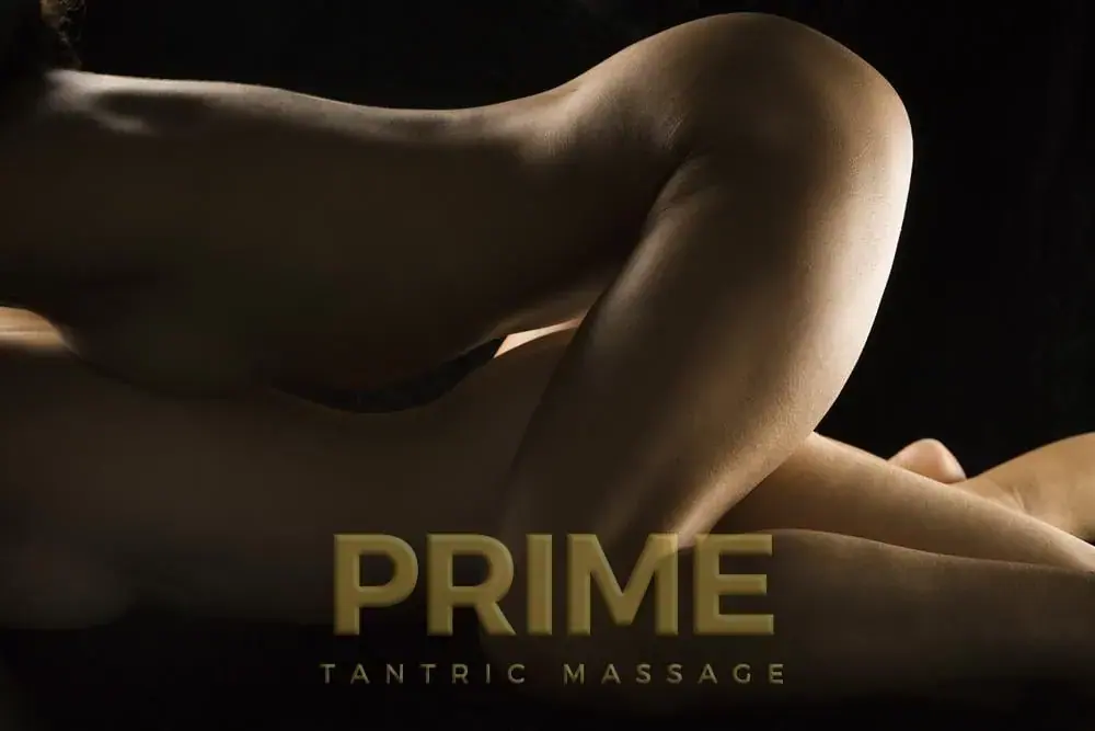 Softly lit close-up of two bodies in warm golden tones, promoting Prime Tantric Massage in London