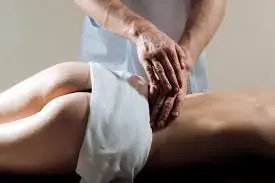 A masseuse giving a relaxing back massage at Shiva Tantric Massages in Barcelona