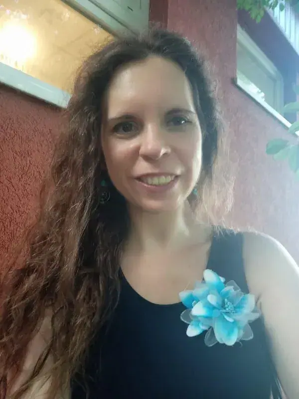 A smiling masseuse at Tamás Kinga Tantra & Tao Yoga in Budapest